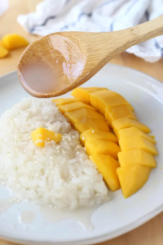 combine sauce and rice to make sticky mango rice